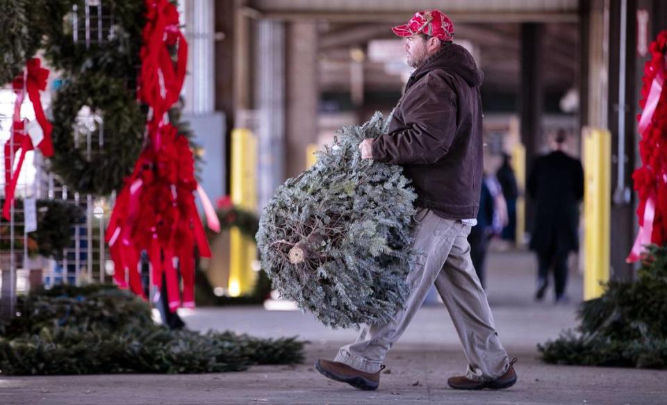 Todd Jernigan of Jernigan’s Nursery from Dunn, N.C. unloads a shipment of Christmas Tree at the State Farmers Market on Tuesday, December 18, 2019 in Raleigh, N.C. His trees come from West Jefferson and Sparta, N.C. Jernigan and one other vendor are the only two vendors still selling trees at the market.