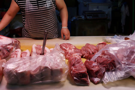 Pork for sale is seen at a stall at a market on the outskirts of Harbin, Heilongjiang province, China September 5, 2018. REUTERS/Hallie Gu