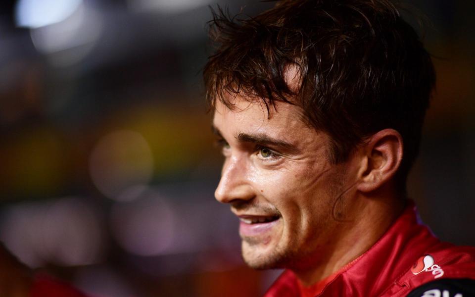 Pole position qualifier Charles Leclerc of Monaco and Ferrari looks on in parc ferme during qualifying ahead of the F1 Grand Prix of Singapore at Marina Bay Street Circuit on October 01, 2022 in Singapore, Singapore. - Mario Renzi - Formula 1/Formula 1 via Getty Images