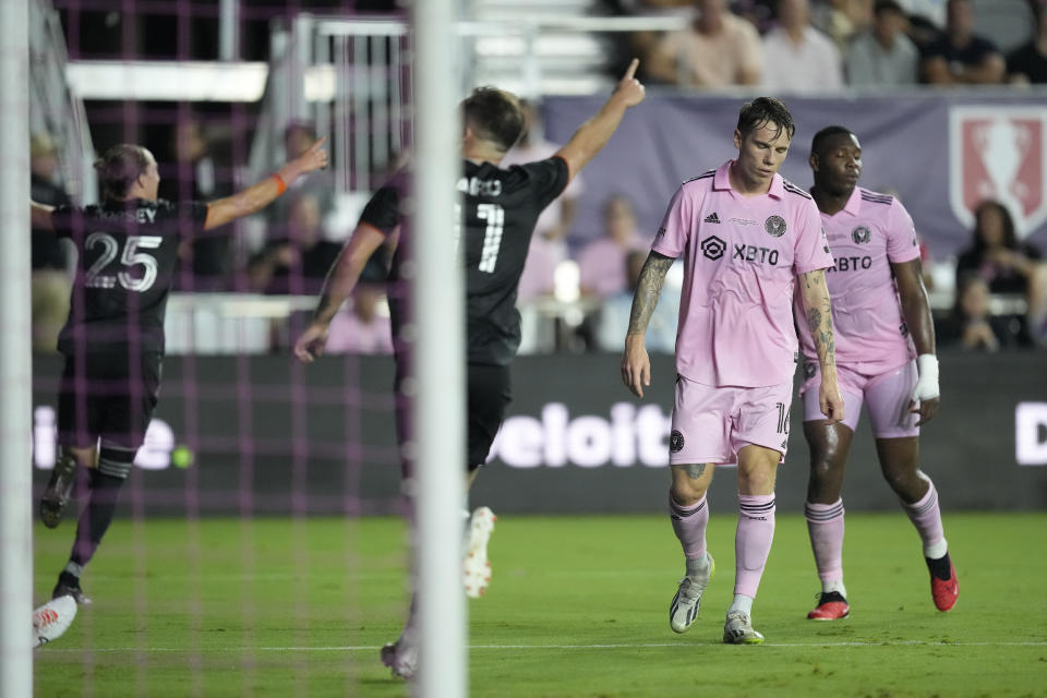 Inter Miami midfielder Robert Taylor (16) reacts as Houston Dynamo midfielder Griffin Dorsey (25) celebrates scoring his side's first goal, in the first half of their U.S. Open Cup final soccer match, Wednesday, Sept. 27, 2023, in Fort Lauderdale, Fla. (AP Photo/Rebecca Blackwell)