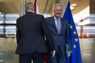 UK Brexit secretary Stephen Barclay, left, is welcomed by European Union chief Brexit negotiator Michel Barnier before their meeting at the European Commission headquarters in Brussels, Friday, Oct. 11, 2019. (AP Photo/Francisco Seco, Pool)
