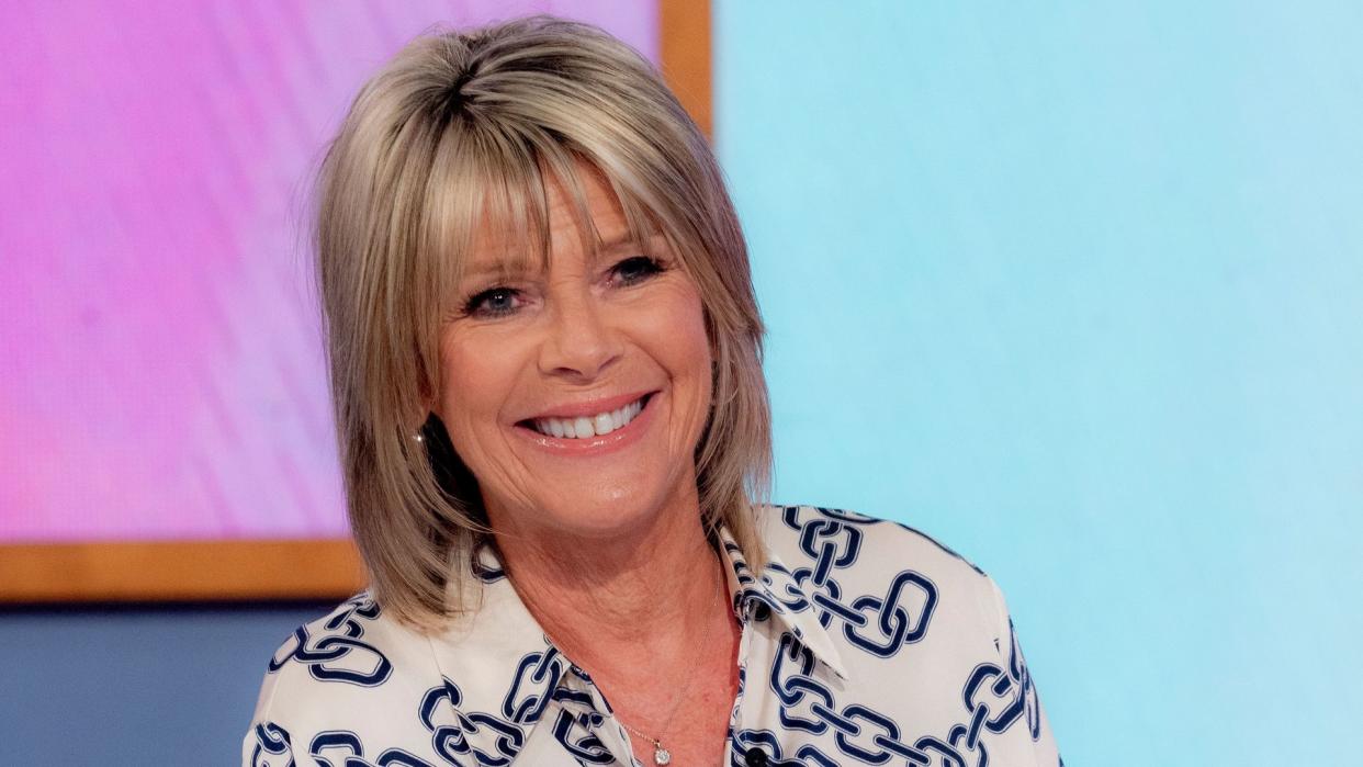 Ruth Langsford smiling in a chain print shirt on Loose Women