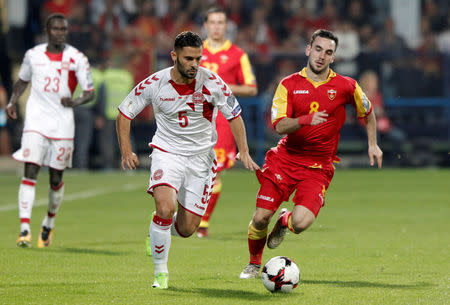 Soccer Football - 2018 World Cup Qualifications - Europe - Montenegro vs Denmark - Podgorica City Stadium, Podgorica, Montenegro - October 5, 2017 Denmark's Riza Durmisi in action with Montenegro's Marko Jankovic REUTERS/Stevo Vasiljevic