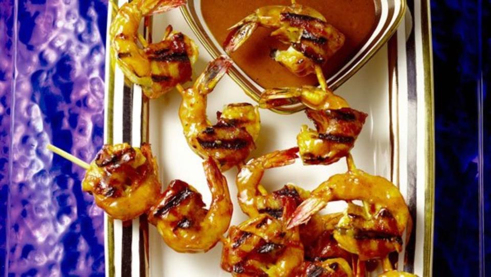 <p>Guy Fieri</p><p>This will put the classic shrimp cocktail to shame!</p><p><strong>Get the recipe: <a href="https://parade.com/26759/guyfieri/bacon-wrapped-shrimp-with-chipotle-bbq-sauce/" rel="nofollow noopener" target="_blank" data-ylk="slk:Bacon-Wrapped Shrimp with Chipotle BBQ Sauce;elm:context_link;itc:0;sec:content-canvas" class="link ">Bacon-Wrapped Shrimp with Chipotle BBQ Sauce</a></strong></p>