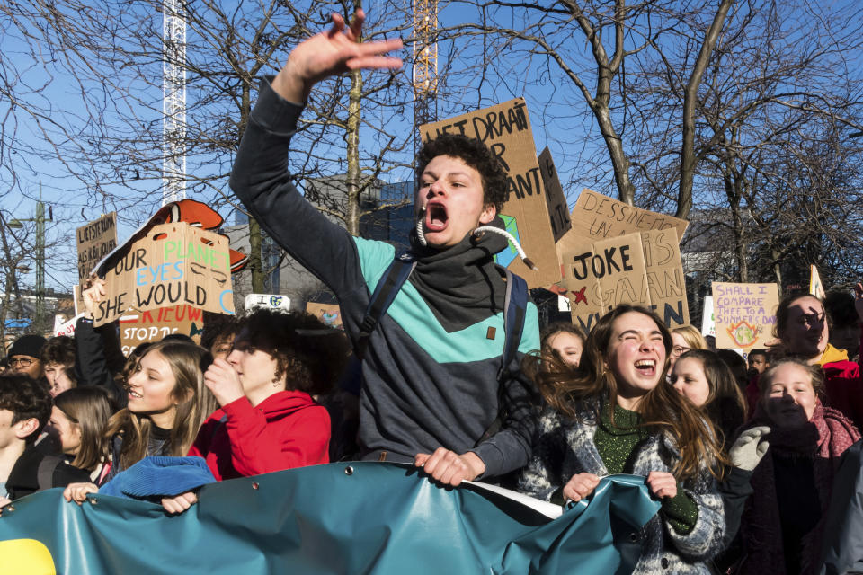 Students march during a climate change protest in Brussels, Thursday, Feb. 14, 2019. Thousands of teenagers in Belgium have skipped school for the sith week in a row in an attempt to push authorities into providing better protection for the world's climate. (AP Photo/Geert Vanden Wijngaert)