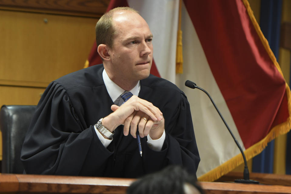 Judge Scott McAfee addresses the lawyers during a hearing on charges against former President Donald Trump in the Georgia election interference case on Thursday, March 28, 2024 in Atlanta. Lawyers for Trump argued in a court filing that the charges against him in the Georgia election interference case seek to criminalize political speech and advocacy conduct that is protected by the First Amendment. (Dennis Byron/Hip Hop Enquirer via AP)