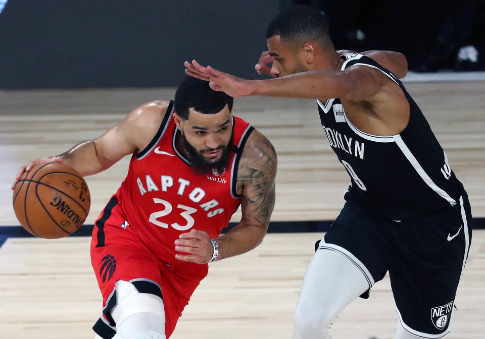 LAKE BUENA VISTA, FLORIDA - AUGUST 23:  Fred VanVleet #23 of the Toronto Raptors moves the ball against Timothe Luwawu-Cabarrot #9 of the Brooklyn Nets during the first half in game four of the first round of the NBA playoffs at The Field House at ESPN Wide World Of Sports Complex on August 23, 2020 in Lake Buena Vista, Florida. NOTE TO USER: User expressly acknowledges and agrees that, by downloading and or using this photograph, User is consenting to the terms and conditions of the Getty Images License Agreement.  (Photo by Kim Klement-Pool/Getty Images)