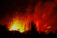 <p>Lava and smoke explodes from Fissure 17 at Leilani Estates in the aftermath of eruptions from the Kilauea volcano on Hawaii’s Big Island, on May 13, 2018 in Pahoa, Hawaii. (Photo: Andrew Richard Hara/Ena Media Hawaii/Getty Images) </p>