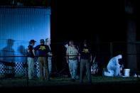 <p>Investigators work outside a trailer near Santa Fe High School following a mass shooting May 18, 2018 in Santa Fe, Texas. (Photo: Brendan Smialowski/AFP/Getty Images) </p>