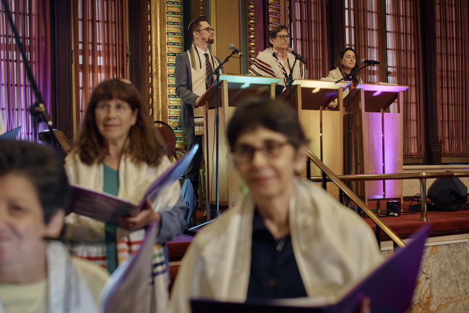 Rabbi Sharon Kleinbaum, top center, speaks during her last service at the Masonic Hall, Friday, June 28, 2024, in New York. (AP Photo/Andres Kudacki)