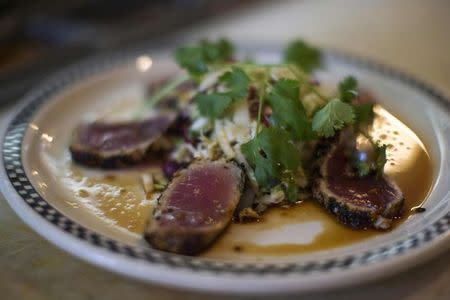 A Seared Ahi Medallions plate is pictured at Kate Mantilini restaurant in Beverly Hills, California June 4, 2014. REUTERS/Mario Anzuoni