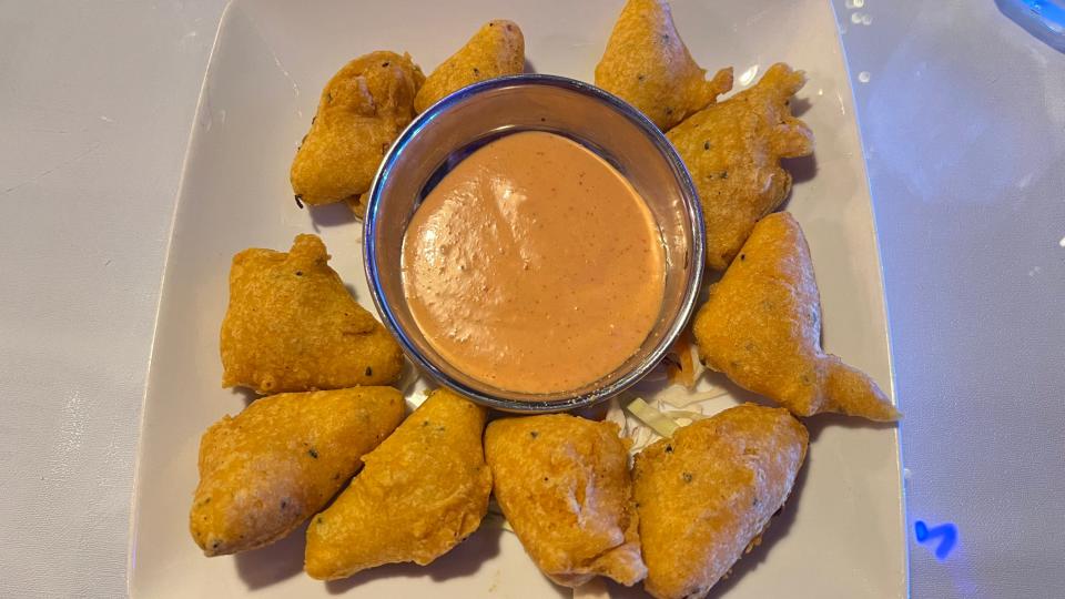 At Bolly Twist Taste of India in Stuart, the paneer pakora is homemade cheese fritters that are crispy-fried in chickpea flour and served with a pink sauce. They were hot, and the cheese was melty and gooey.