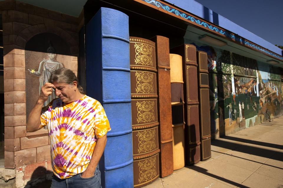 Iliad owner Dan Weinstein stands outside the store in a tie-dyed T-shrit.