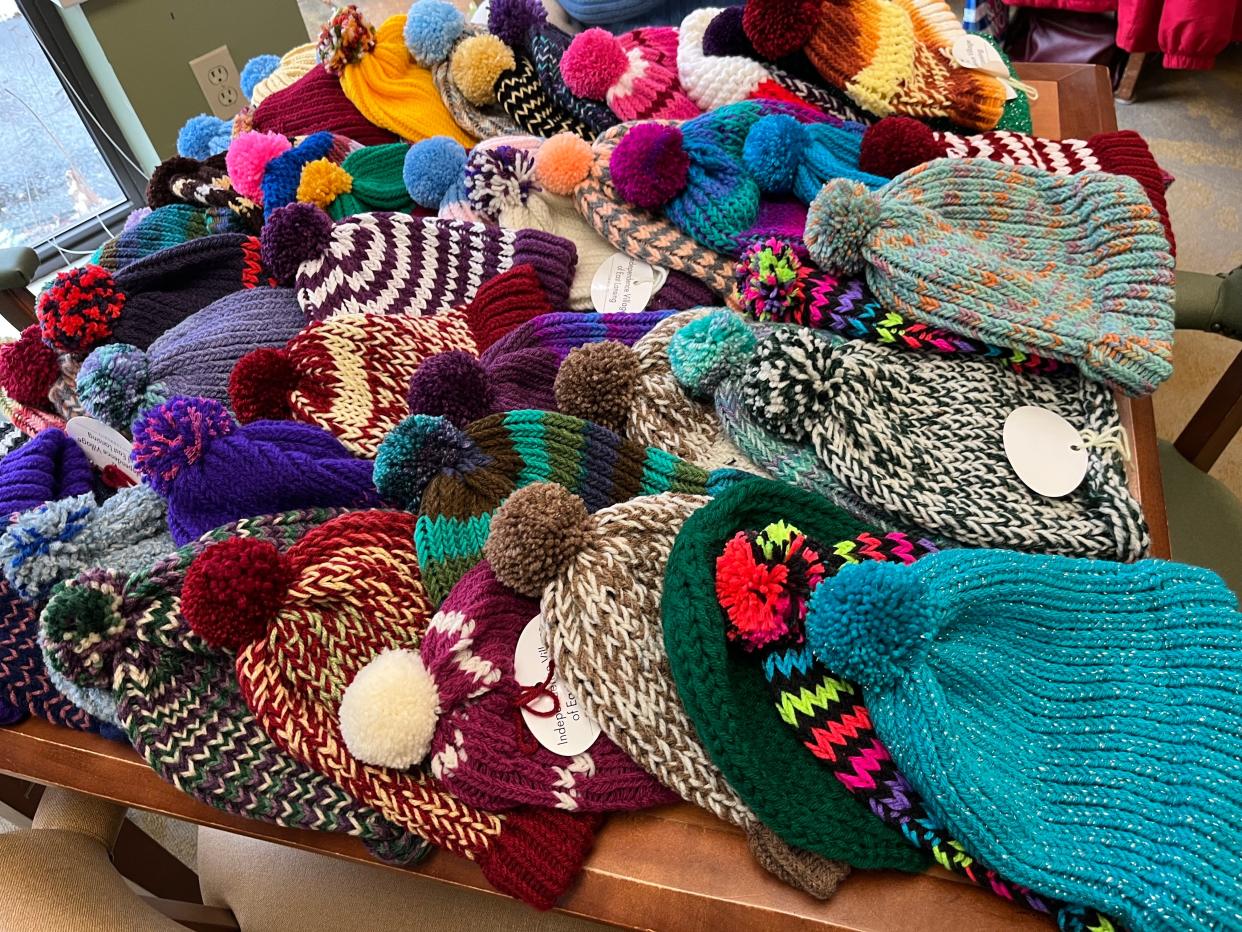 Dozens of hats are displayed in Independence Village of East Lansing on Thursday, Nov. 17, 2022, before being donated.