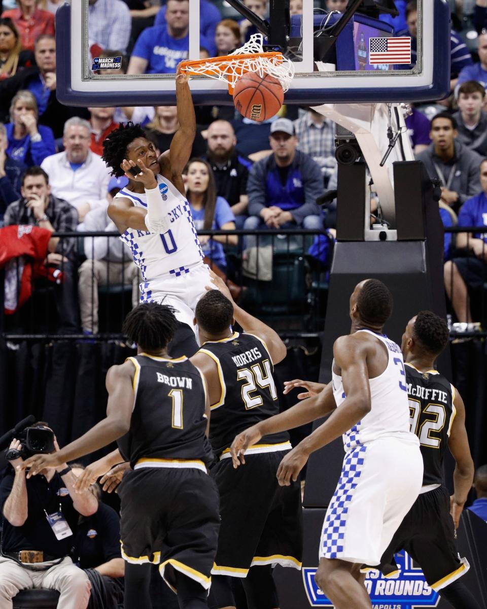 <p>De’Aaron Fox #0 of the Kentucky Wildcats dunks against the Wichita State Shockers in the second half during the second round of the 2017 NCAA Men’s Basketball Tournament at the Bankers Life Fieldhouse on March 19, 2017 in Indianapolis, Indiana. The Kentucky Wildcats won 65-62. (Photo by Joe Robbins/Getty Images) </p>