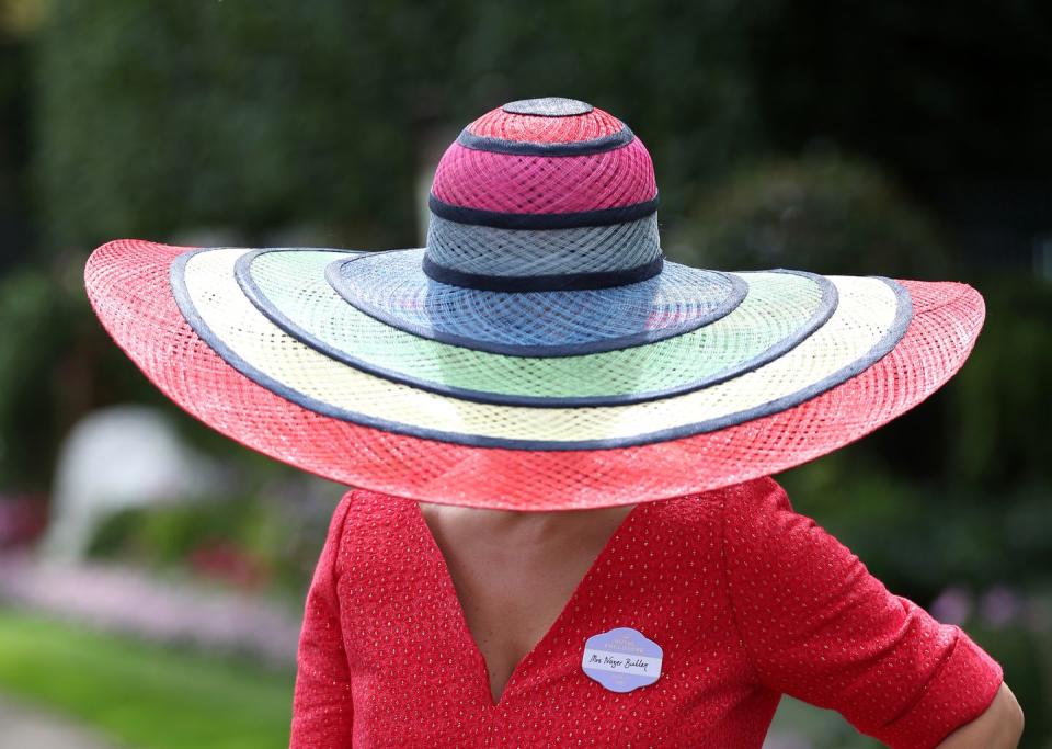 <p>Nazer Bullen went colorful in this rainbow striped floppy hat. </p>