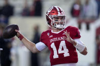 Indiana quarterback Jack Tuttle (14) throws during warmups before playing Ohio State in an NCAA college football game in Bloomington, Ind., Saturday, Oct. 23, 2021. (AP Photo/AJ Mast)