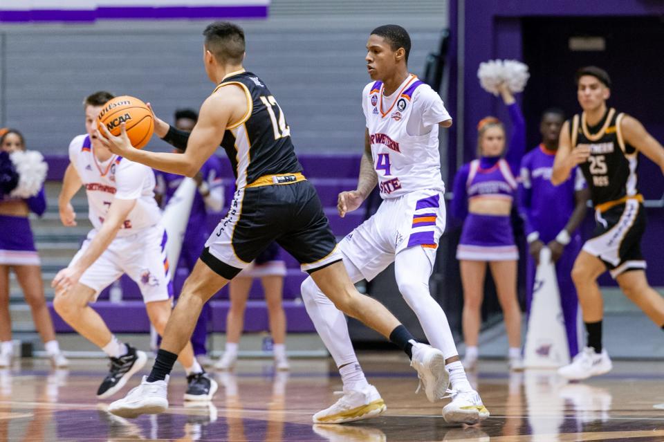Northwestern State University guard Hansel Enmanuel, right, plays defense against Southern Miss on Dec. 12, 2022 in Natchitoches, La.