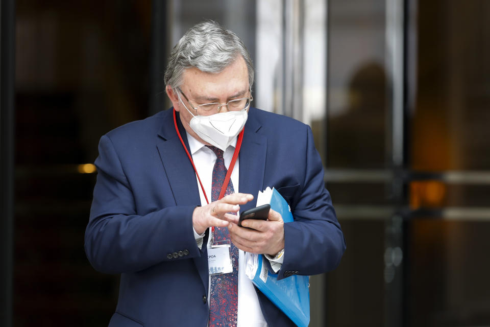 FILE - In this file photo dated Tuesday, April 27, 2021, Russia's Governor to the International Atomic Energy Agency (IAEA), Mikhail Ulyanov leaves after closed-door nuclear talks with Iran in Vienna, Austria. World powers have held a fourth round of high-level talks Friday May 7, 2021, aimed at bringing the United States back into a landmark nuclear deal with Iran and both sides suggested a resolution was possible. Mikhail Ulyanov tweeted following Friday's meeting that “the participants agreed on the need to intensify the process.” (AP Photo/Lisa Leutner, FILE)