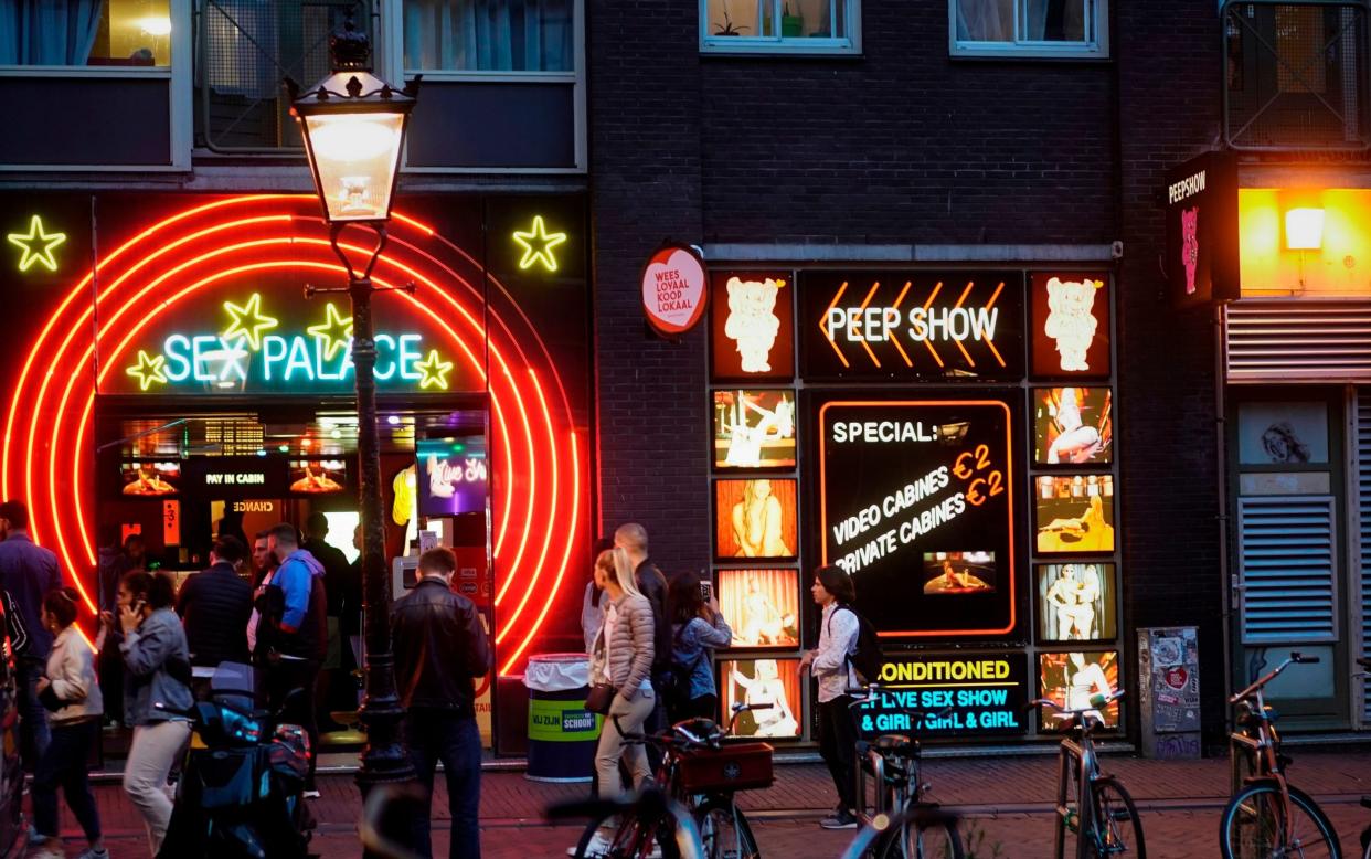 British tourists on blow-out weekends are amongst the biggest sources of nuisance, according to the Red Light District's locals - KENZO TRIBOUILLARD/AFP