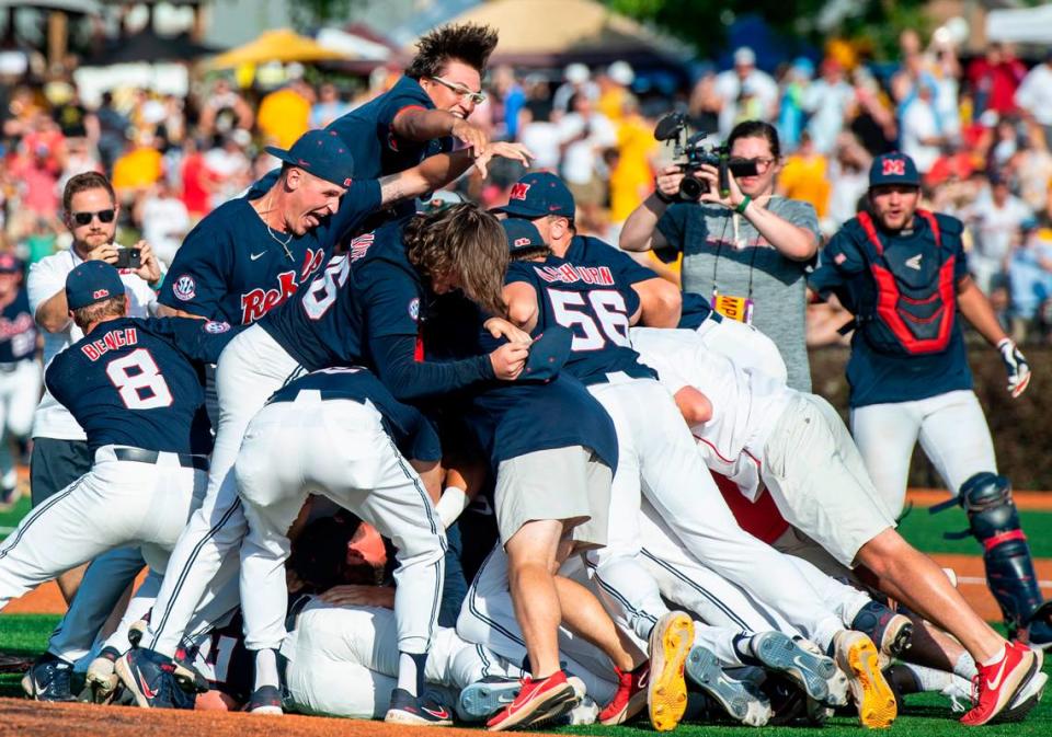 Ole Miss players dog pile after winning a shot at the College World Series during the Super Regionals Final at Pete Taylor Park in Hattiesburg on Sunday, June 12, 2022.