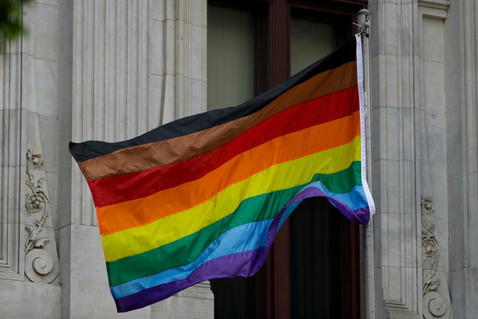 In this Monday, June 19, 2017, Philadelphia's altered gay pride flag is seen outside City Hall.