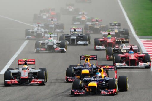 Red Bull Racing's German driver Sebastian Vettel leads after the start at the Bahrain International circuit in Manama during the Bahrain Formula One Grand Prix. Vettel fended off returning former champion Kimi Raikkonen to win the Bahrain Grand Prix here on Sunday for the Red Bull driver's first win of 2012