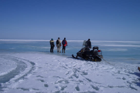 A thin crust of snow hides sea ice in various stages of melting and re-freezing. Sea ice temperature and salinity are critical to determining whether or not percolation will occur.