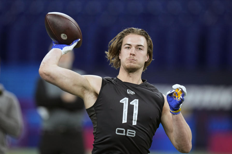 FILE - Pittsburgh quarterback Kenny Pickett throws during the NFL football scouting combine, Thursday, March 3, 2022, in Indianapolis. Franchises still searching for a prized quarterback won't find much star power in this year's crop of college QBs. Still, there's potential upgrades to be had in the likes of Temple's Malik Willis and Pitt's Kenny Pickett. (AP Photo/Darron Cummings, File)