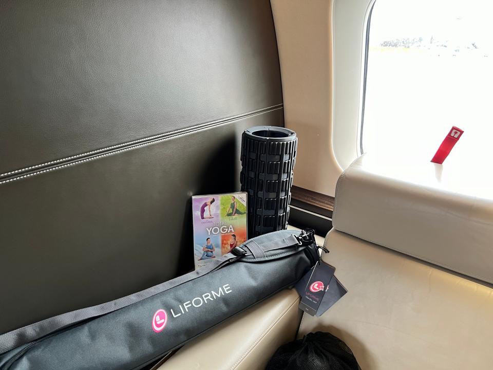 A Yoga mat, roller and booklet on board a VistaJet Bombardier Global 7500 at Farnborough Airport