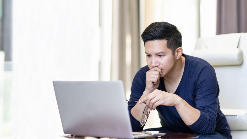 A man looks over the investment options in his IRA. 