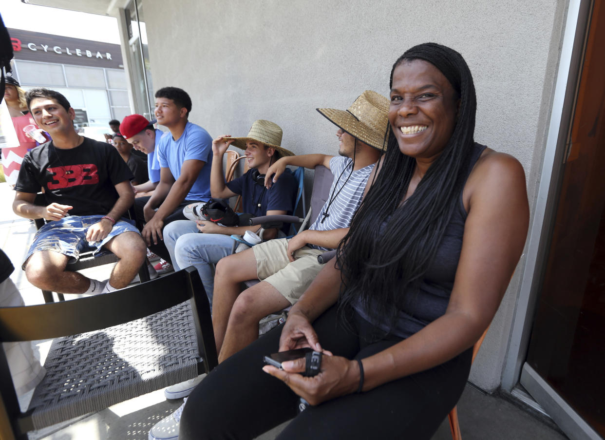 Janet Raines of Los Angeles says she arrived at 7:30 a.m. to be the first in line to see LeBron James at Blaze Pizza. (AP Photo)