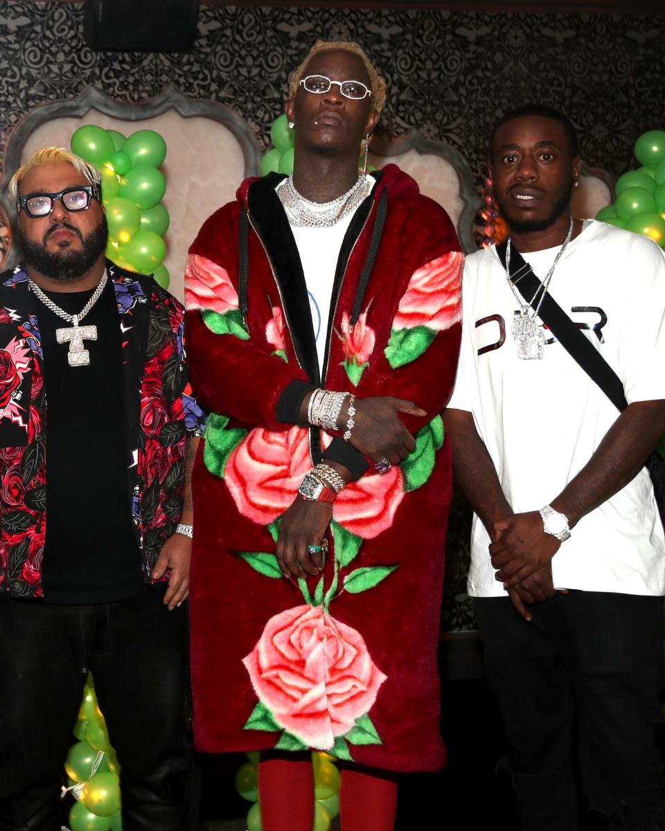 Young Thug celebrates his new album (and birthday!) as only Young Thug can: in an enormous rose-printed hoodie-slash-robe.