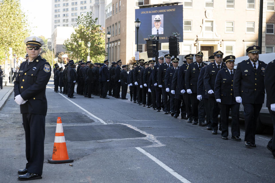 Law enforcement officers gather for a viewing for officer Richard Mendez at the Cathedral Basilica of Saints Peter and Paul in Philadelphia, Tuesday, Oct. 24, 2023. Mendez was shot and killed, and a second officer was wounded when they confronted people breaking into a car at Philadelphia International Airport, Oct. 12, police said. (AP Photo/Joe Lamberti)