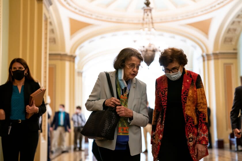 WASHINGTON, DC - SEPTEMBER 30: Sen. Dianne Feinstein (D-CA) speaks with Sen. Jacky Rosen (D-NV) out side the Senate Chamber at the U.S. Capitol on Thursday, Sept. 30, 2021 in Washington, DC. The Senate passed a short term spending bill to avoid a government shutdown. (Kent Nishimura / Los Angeles Times)