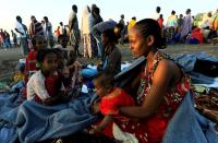 FILE PHOTO: Ethiopian women who fled the ongoing fighting in Tigray region, gather in Hamdayet village near the Setit river on the Sudan-Ethiopia border in eastern Kassala state