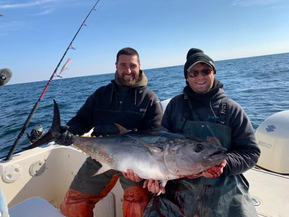 Cobi Capri, left, and John Cavaliere with a 60-pound bluefin tuna landed on the Hi Flier charter boat.