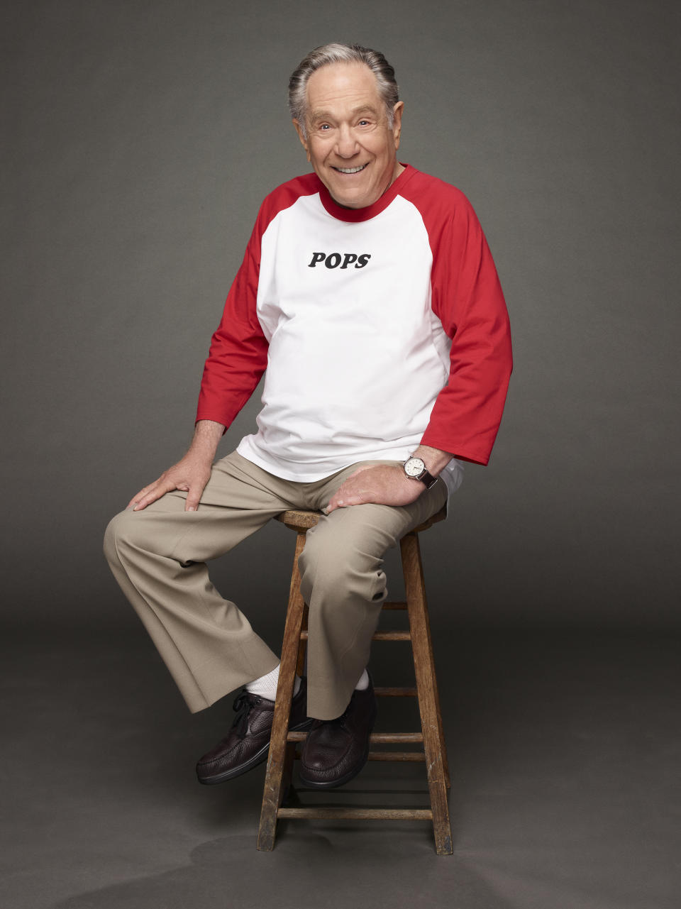 This image released by ABC shows a portrait of George Segal, who portrays Pops Solomon, the comedy series, "The Goldbergs." Segal, the banjo player turned actor who was nominated for an Oscar for 1966's “Who’s Afraid of Virginia Woolf?,” and starred in the ABC sitcom “The Goldbergs,” died Tuesday, his wife said. He was 87. (ABC via AP)