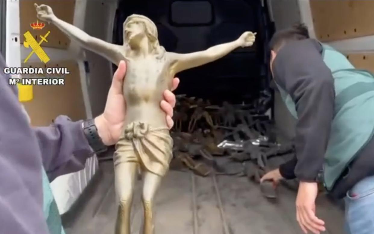 Police seize dozens of crucifixes from the gang's centre of operations in the Madrid region