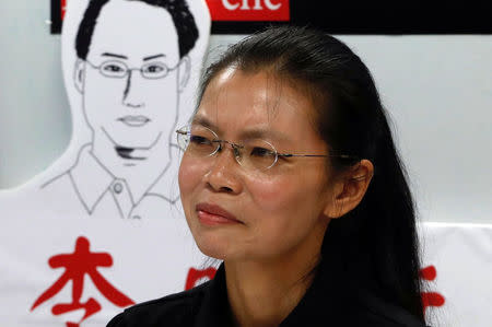 Lee Ching-yu, wife of Taiwan human rights advocate Lee Ming-che, who has been detained in China, speaks to the media a day before departing for her husband's trial, in Taipei, Taiwan September 9, 2017. REUTERS/Tyrone Siu