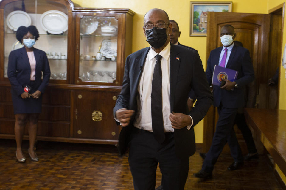 Haiti's Prime Minister Ariel Henry arrives for an interview with the Associated Press at his private residence in Port-au-Prince, Tuesday, Sept. 28, 2021. (AP Photo/Joseph Odelyn)