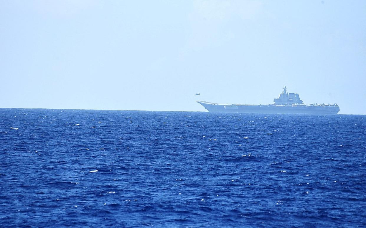 A helicopter takes off from China's Shandong aircraft carrier