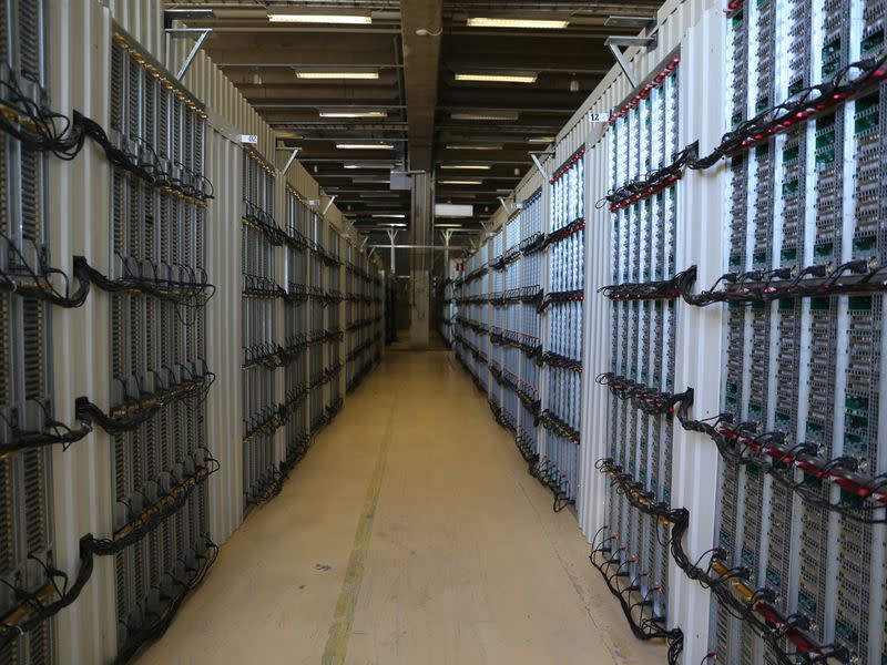 Moving through HIVE Blockchain's ethereum mining facility in Boden, Sweden, feels like teleporting between the Arctic and a tropical beach every few feet. (Sandali Handagama)