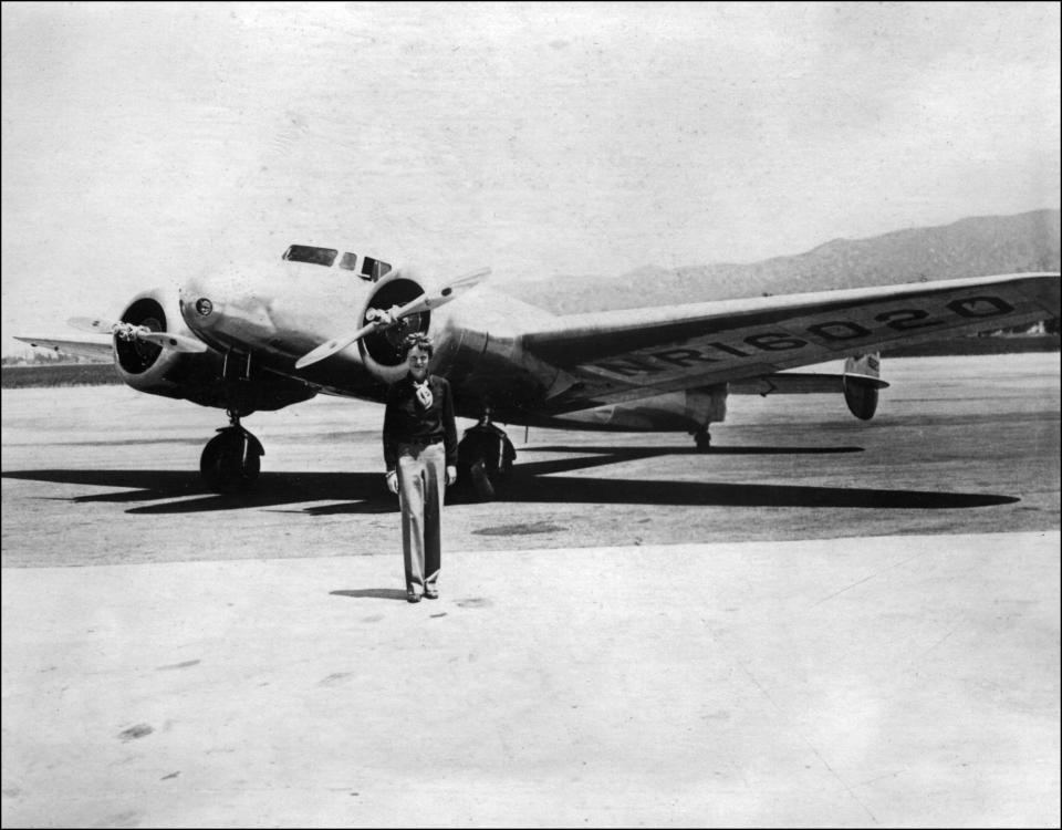 Undated picture taken in the 30' s of American female aviator Amelia Earhart in front of her plane.