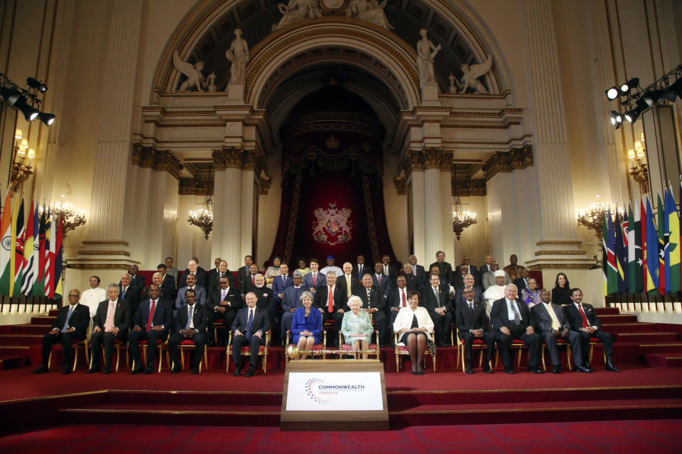 FILE - The Commonwealth leaders pose for a group photograph with Britain's Queen Elizabeth II, front center right, during the formal opening of the Commonwealth Heads of Government Meeting in the ballroom at Buckingham Palace in London, Thursday April 19, 2018. (Yui Mok/Pool via AP, File)