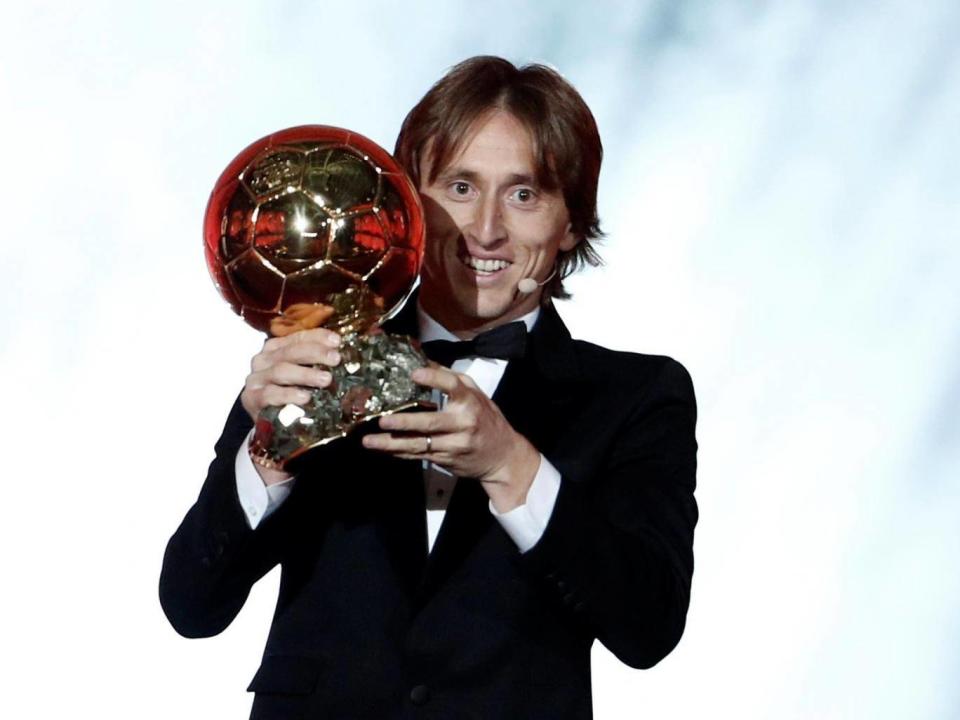 Luka Modric celebrates with the Ballon d’Or (Reuters)