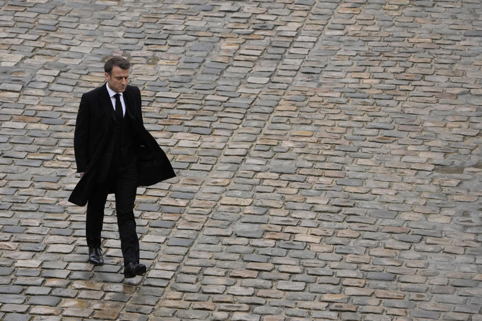 French President Emmanuel Macron walks back during a ceremony at the Invalides monument, Wednesday, Feb.7, 2024. France is paying tribute Wednesday to French victims of Hamas' Oct. 7 attack, in a national ceremony led by President Emmanuel Macron four months after the deadly assault in Israel that killed some 1,200 people, mostly civilians, and saw around 250 abducted. (AP Photo/Thibault Camus)