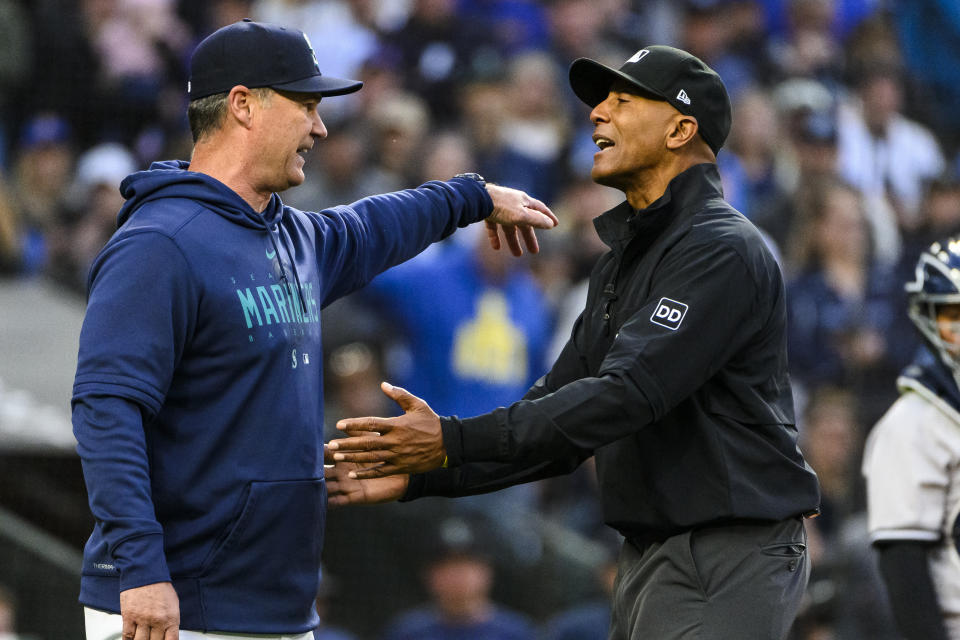 Seattle Mariners' manager Scott Servais argues with first base umpire CB Bucknor after being ejected during the sixth inning of the team's baseball game against the New York Yankees, Tuesday, May 30, 2023, in Seattle. (AP Photo/Caean Couto)