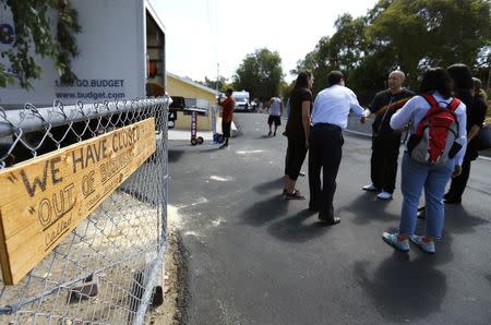 Hollywood mogul and co-creator of The Simpsons, Sam Simon (C), arrives to view a chinchilla farm after he financed the purchase of the facility by PETA (People for the Ethical Treatment of Animals) in order to rescue over 400 chinchillas and shutter the business in Vista, California August 19, 2014. REUTERS/Mike Blake