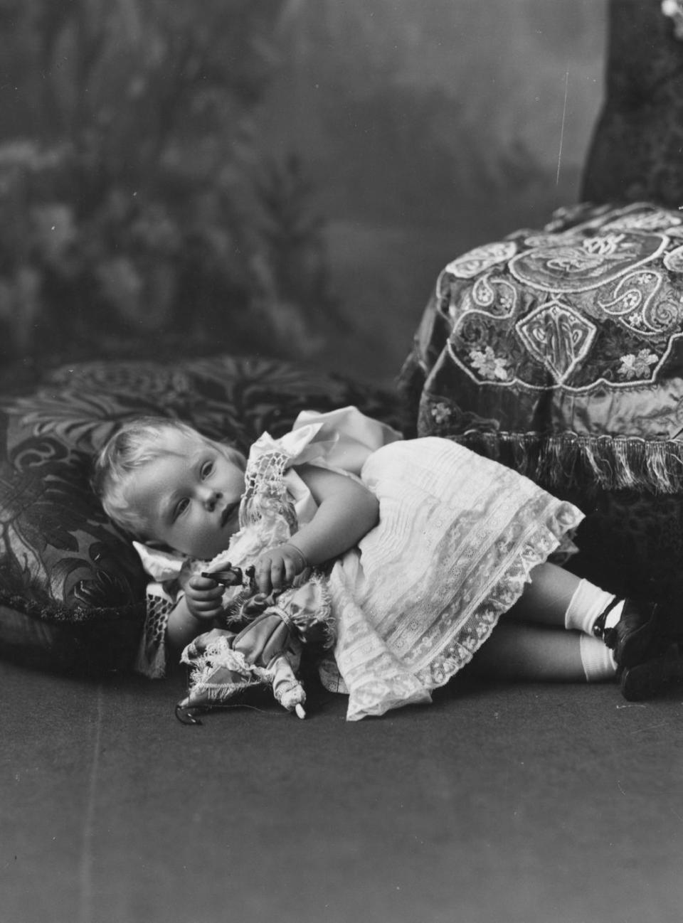 <p>Edward, the eldest son of King George V and Queen Mary, is photographed resting on a pillow at around 6 months old. In 1936, Edward officially became King Edward VIII but abdicated the throne in less than one year so he could marry American divorcée Wallis Simpson. Edward's brother, King George VI, took over the throne, while Edward became the Duke of Windsor.</p>